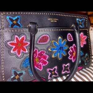 Henri Bendel purse with beautiful floral design on the bag. Used-like new